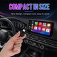 Black compact wireless car adapter held in hand with green power icon
