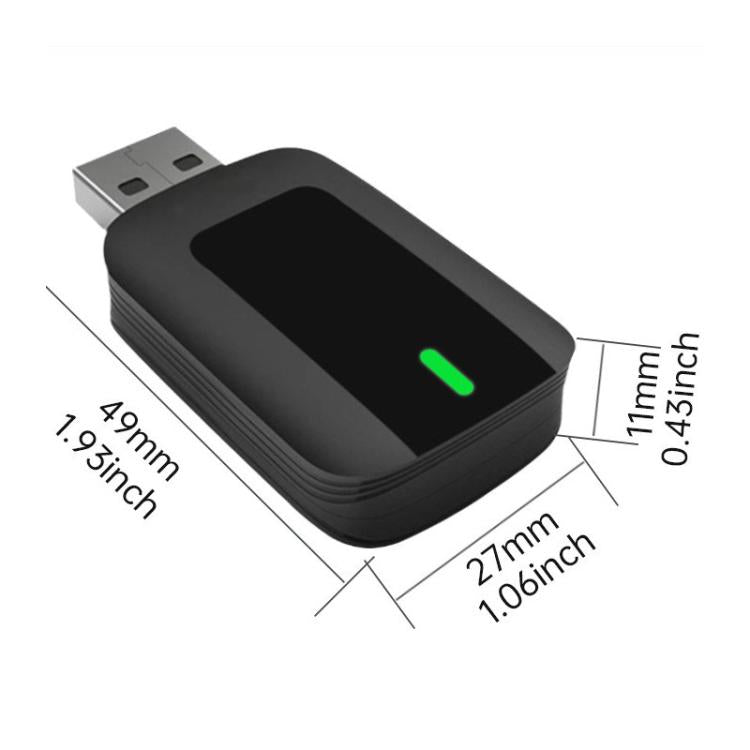 Compact black wireless car adapter with USB plug and green status light, shown with size