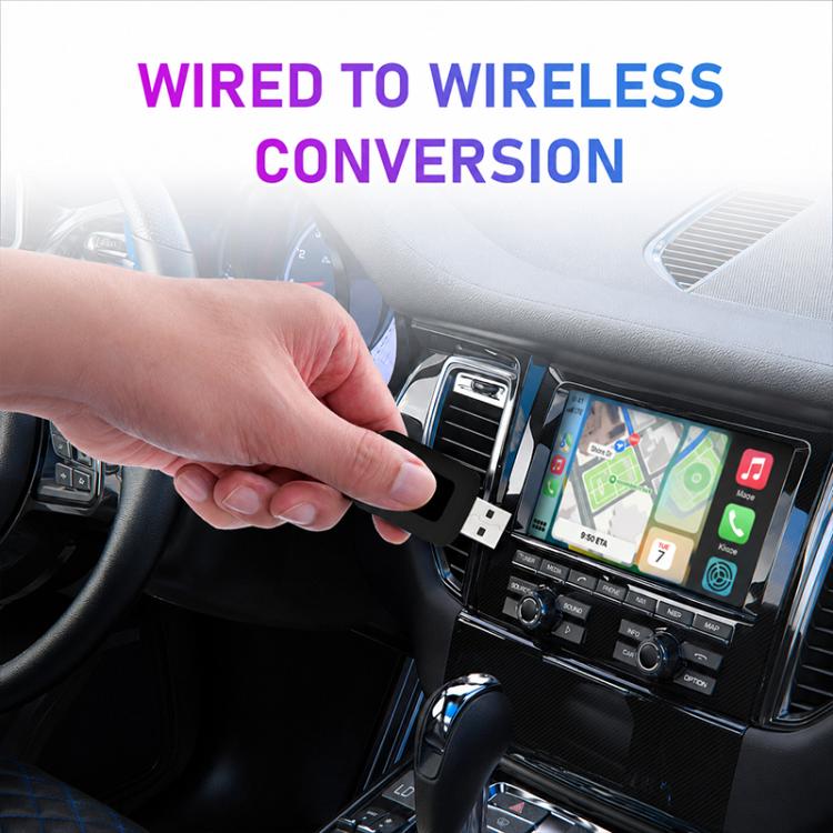 Wireless car adapter being plugged into a car’s USB port, ready for wireless use