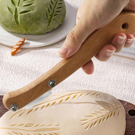 Curved wooden bread scoring tool with metal blade and two fastening screws