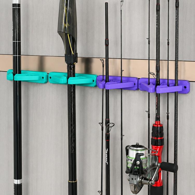 Wall-mounted silicone fishing rod holder with teal and purple bar grips for rods