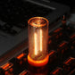 Yellow-orange glowing USB LED cylinder atmosphere light with dotted side grille