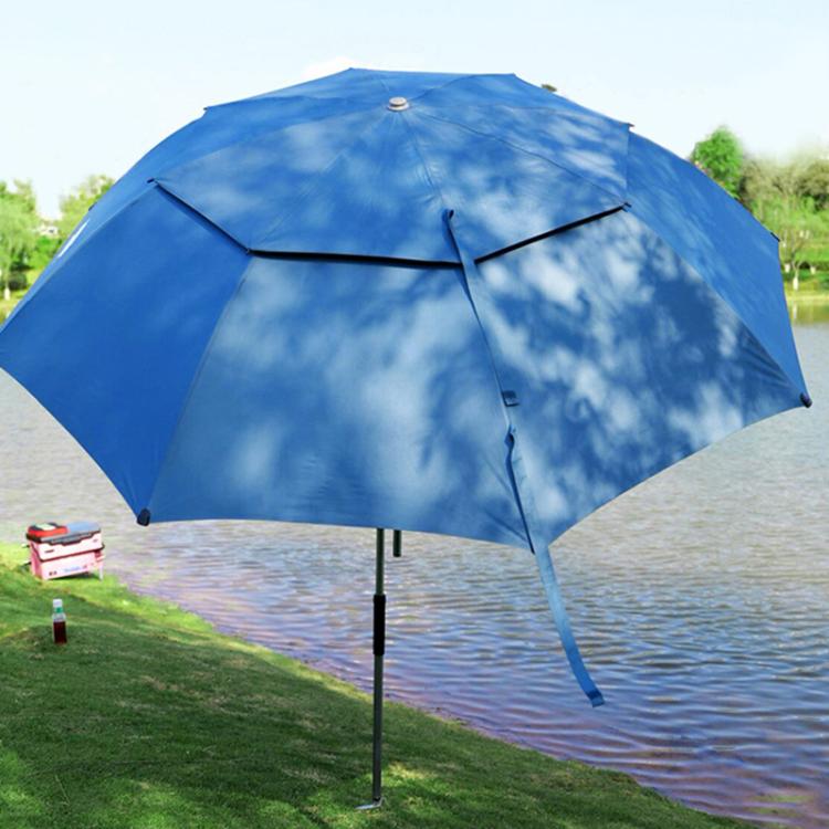 Blue umbrella held by black umbrella ground stake with a forked base