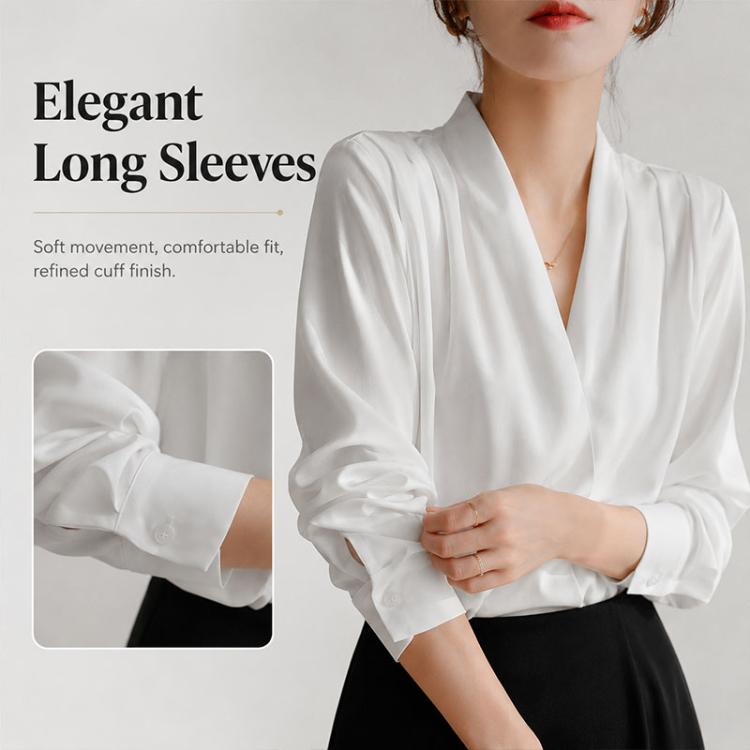 White satin V-neck blouse with long sleeves and gathered button cuff detail