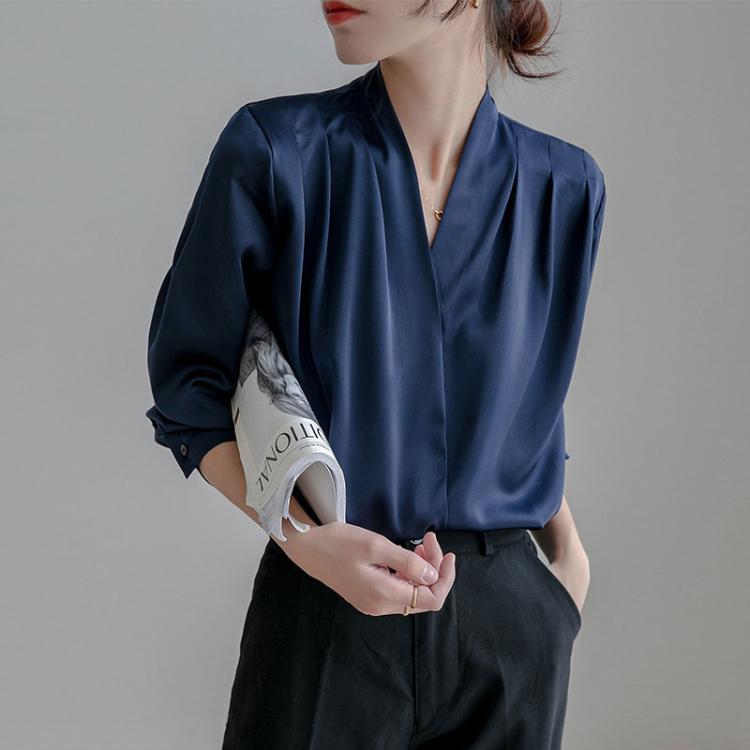Navy satin V-neck blouse with long sleeves and pleated front detail