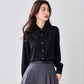 Black satin pointed-collar long-sleeve blouse with button front and neat cuffs