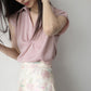 Women’s twist V-neck cap sleeve blouse in light pink, front drape detail