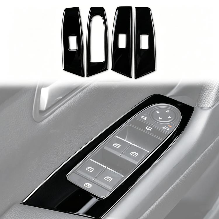 Set of four black window lift switch panel trim pieces with silver control cutouts