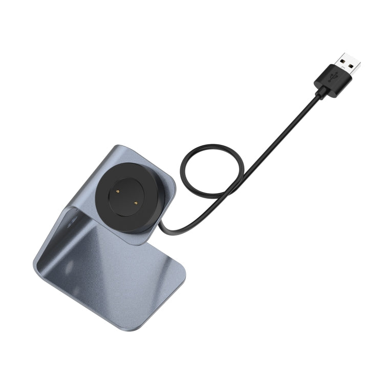 Magnetic watch charging stand with grey base and USB cable, round charger pad
