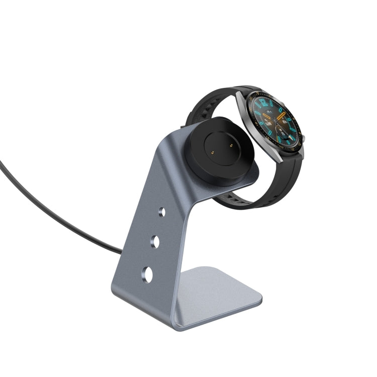 Magnetic watch charger stand with grey base, cable, and watch placed on dock