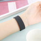 Charcoal woven silicone watch band on wrist