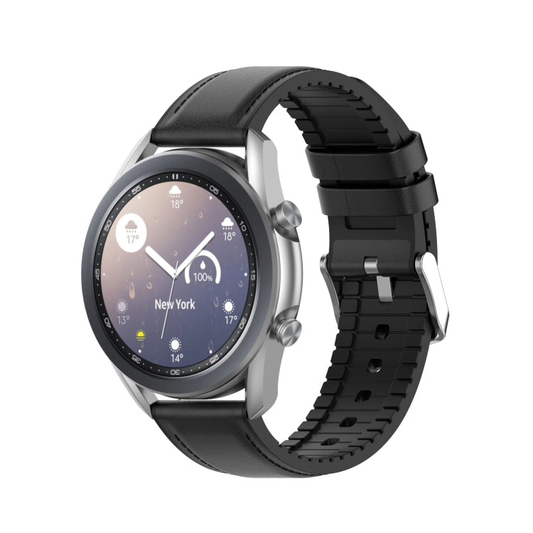 Black silicone watch strap with metal buckle, shown with watch case attached