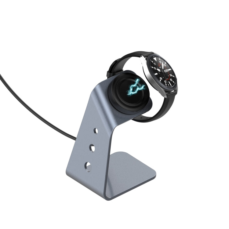 Grey magnetic watch charger dock holding a smartwatch on an aluminum stand
