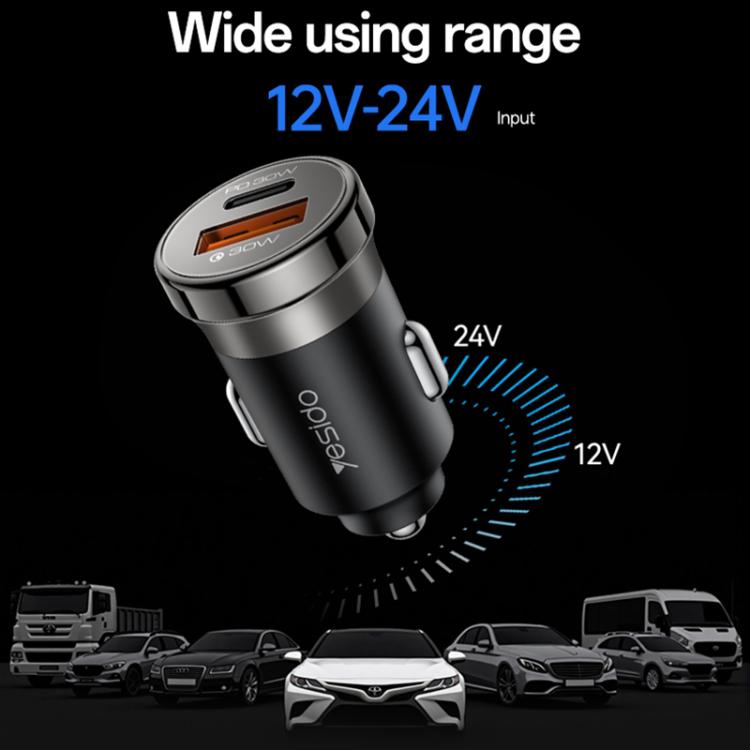 Black dual-port car charger with orange USB port and wide input range icons