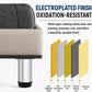 Stainless steel furniture leg with black base ring under an upholstered sofa