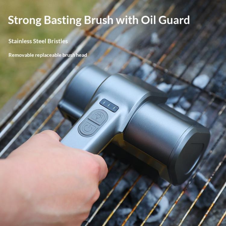 Electric grill cleaning brush with metallic gray body and rotating bristle drum