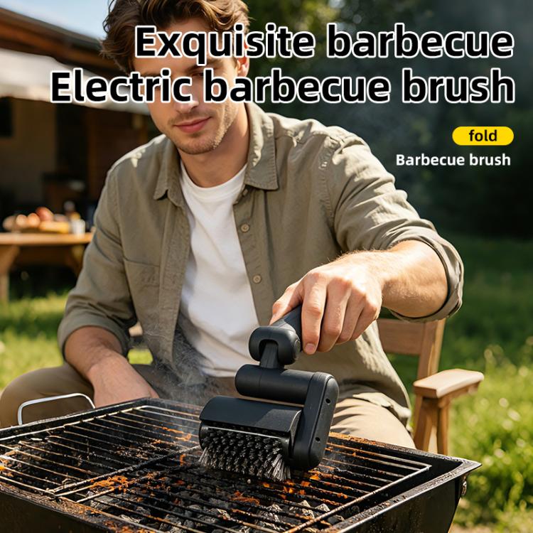Black electric BBQ cleaning brush pressed on grill grate for scrubbing
