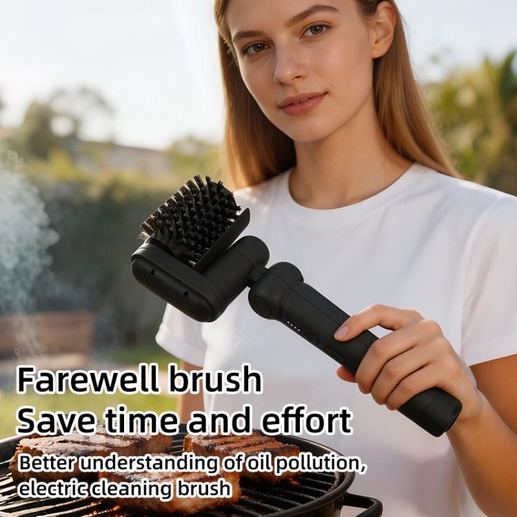 Black electric BBQ cleaning brush held in hand with bristle cleaning head
