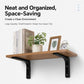 Black L-shaped wall shelf support brace with screws under a wooden shelf