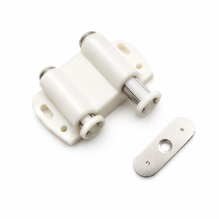 Beige handle-free cabinet door latch with metal mounting plate and striker