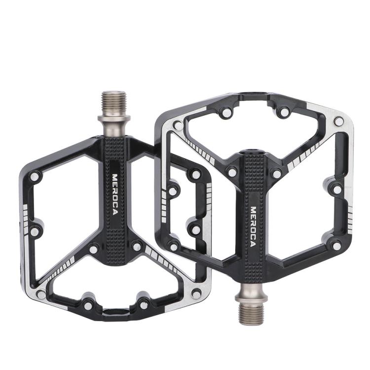 Black mountain bike pedals with dual platform and metal traction studs