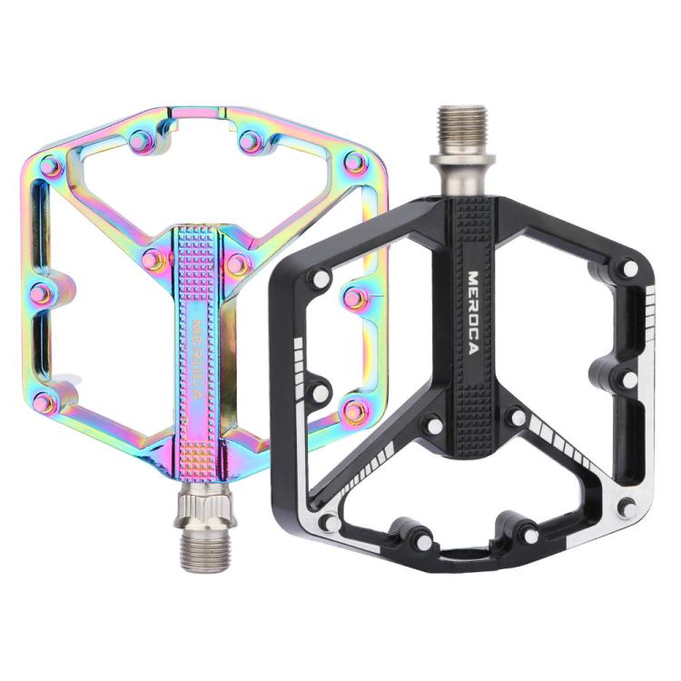 Rainbow and black mountain bike pedals, each with dual platform and axle