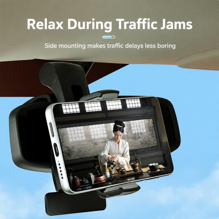 Dashboard side-mount phone holder holding smartphone in landscape