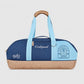 Sports tote bag in navy and light blue with tan base, top handle, Godspeed logo panel.