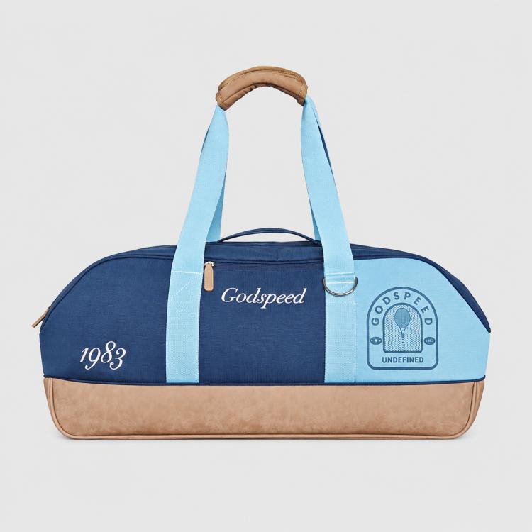 Sports tote bag in navy and light blue with tan base, top handle, Godspeed logo panel.