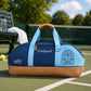 Navy and light blue sports tote bag with tan base, padded handles, Godspeed and Pelta logos.