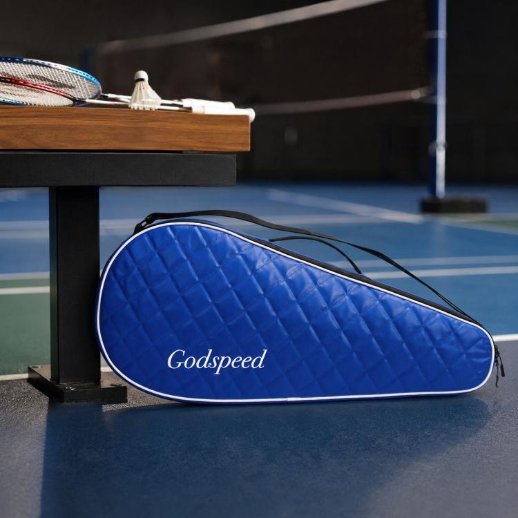 Blue quilted badminton racket bag with black trim and zippered opening