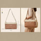 Compact orange crossbody gym handbag with adjustable shoulder strap and zip closure