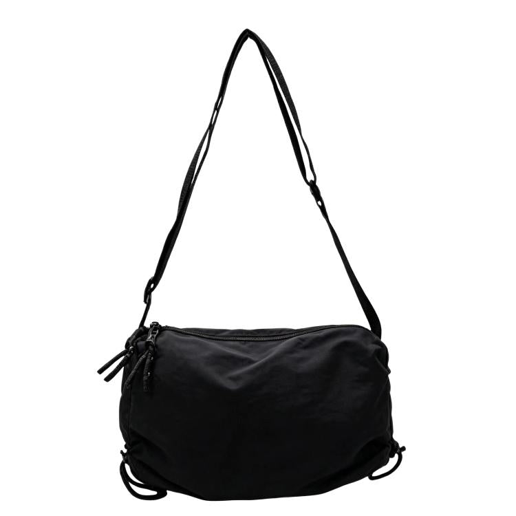 Black nylon drawstring crossbody bag with adjustable shoulder strap and cinch closure