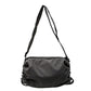 Grey nylon drawstring crossbody bag with adjustable shoulder strap and cinch closure