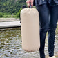 Khaki weighted water bag with screw valve and handle, carried upright
