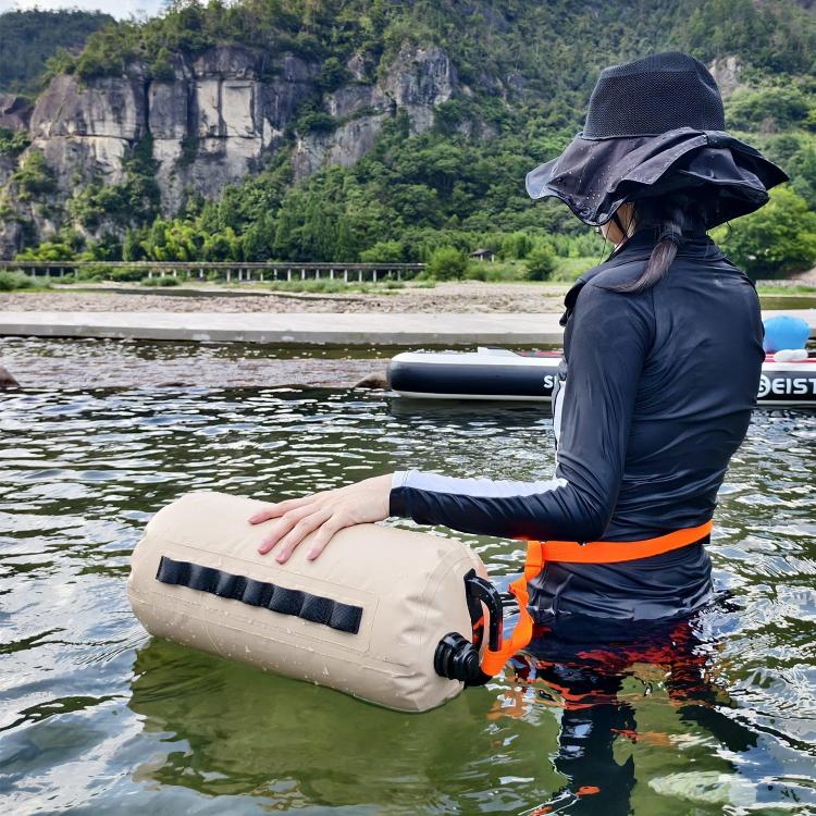Khaki outdoor water storage bag with orange straps and black valve caps