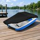 Pedal boat cover with black top fabric on blue-and-gray pedal boat, secured over deck