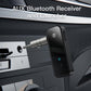 Mini Bluetooth AUX adapter shown with metal 3.5mm plug and black receiver housing