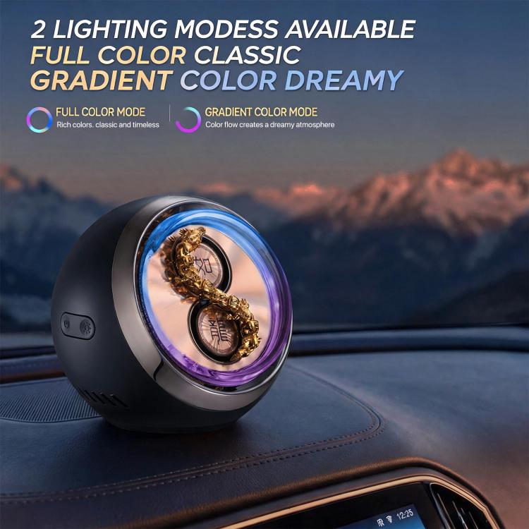Car aromatherapy ornament with blue LED light, dark base and rotating dragon detail
