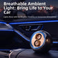 Car aromatherapy ornament on console, dark round device with blue glow and dragon motif