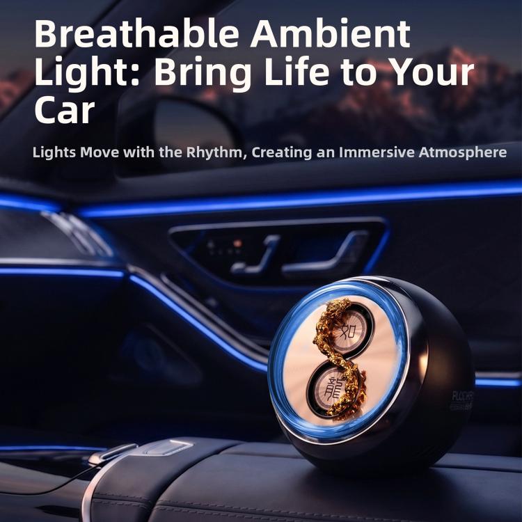 Car aromatherapy ornament on console, dark round device with blue glow and dragon motif