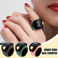 Green smart prayer ring counter worn on fingers, gold roller button visible