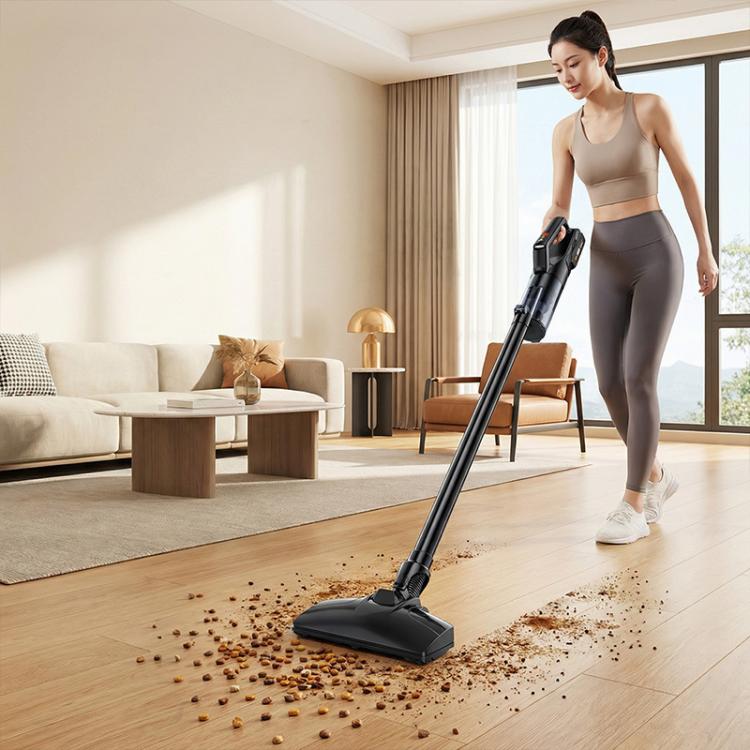 Handheld cordless car vacuum cleaner used on hardwood floor with floor nozzle