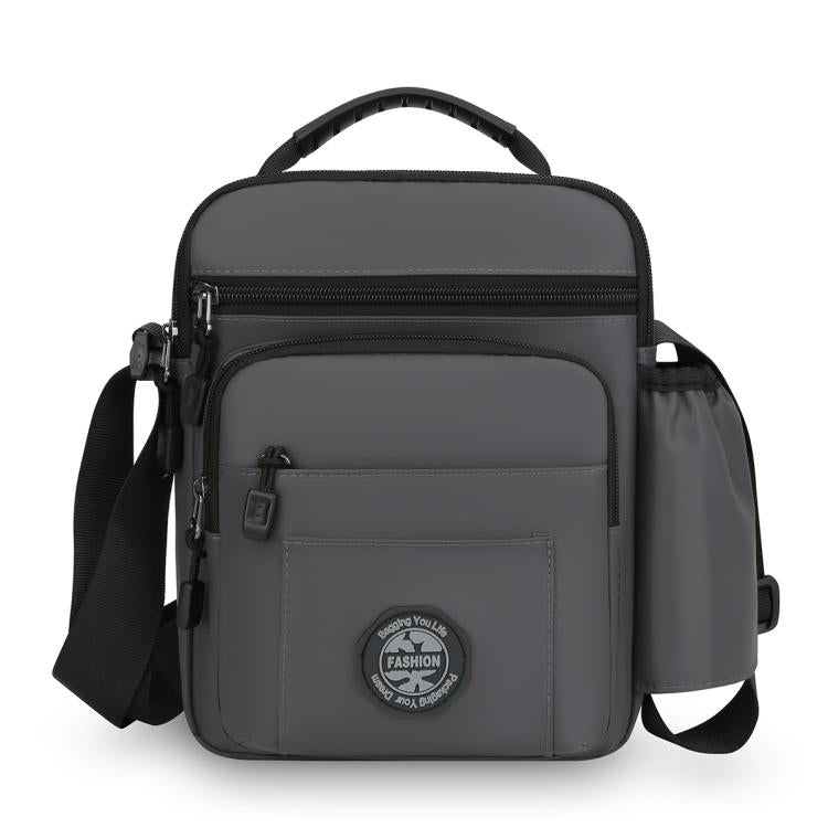 Grey men's crossbody bag with zip front pocket and adjustable shoulder strap