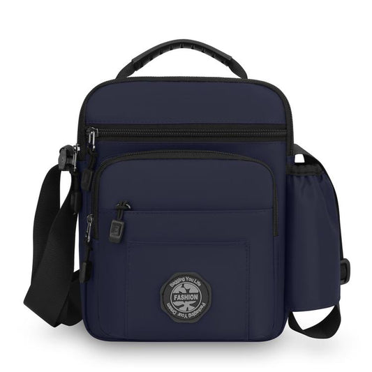 Navy blue men's crossbody bag with zip front pocket and adjustable shoulder strap