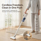 White cordless stick vacuum cleaner with floor nozzle held upright for cleaning