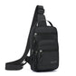 Black crossbody chest bag with front zip pockets, front hanging straps, and adjustable shoulder strap