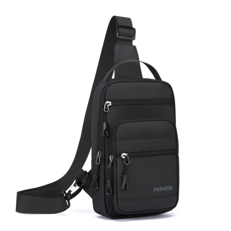 Black crossbody chest bag with front zip pockets, front hanging straps, and adjustable shoulder strap