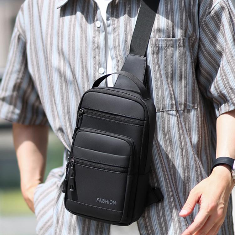 Men's black waterproof crossbody chest bag with zip front pockets and adjustable strap