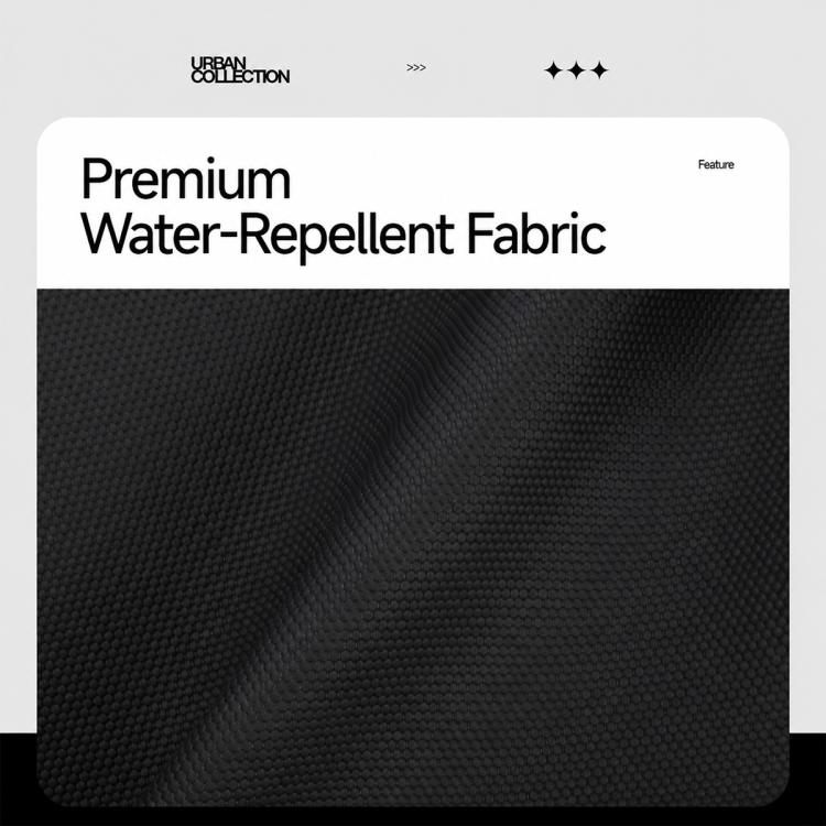 Black textured fabric panel of a crossbody chest bag with water-repellent look